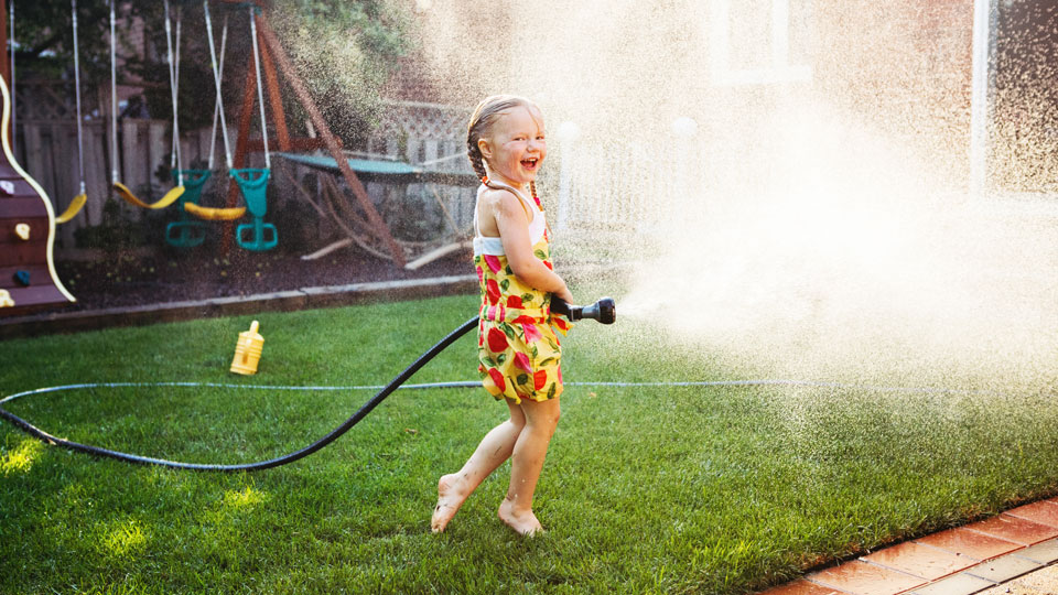 Girl playing with hose